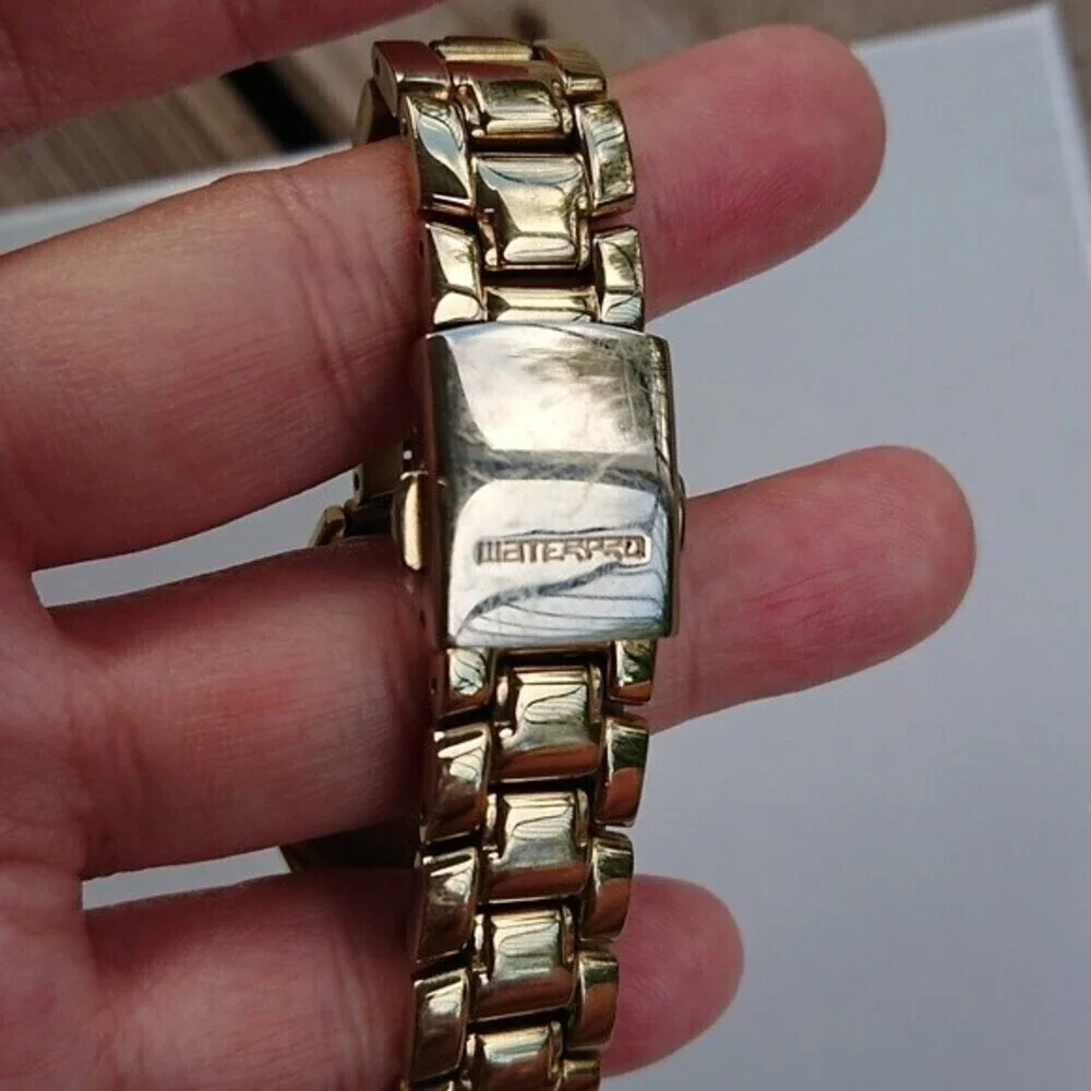 Guess Analog gold tone with rhinestones Watch